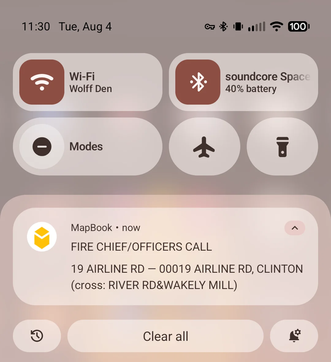 MapBook dispatch notification on an Android phone, showing call type, address and cross streets
